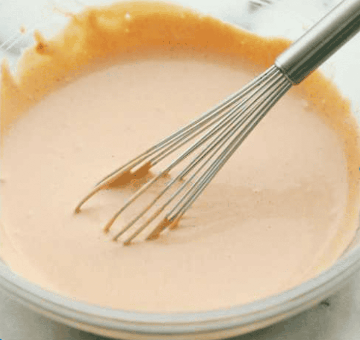 All of the ingredients whisked together in a bowl. 